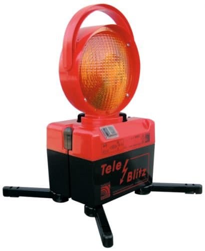 Tele-flash with battery 6 V including charging adapter, on one side.